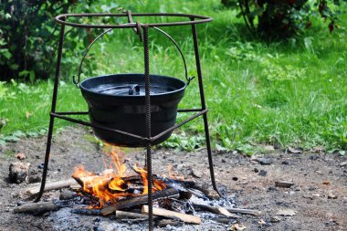 Cooking in cauldron clipart