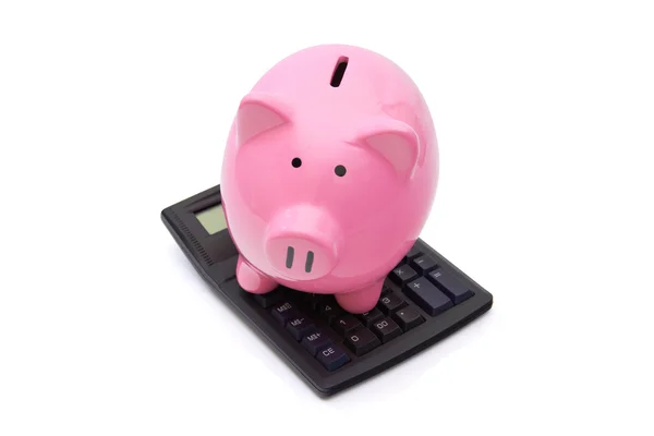 Pink Piggy Bank en la calculadora —  Fotos de Stock