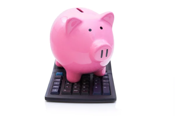 Piggy Bank rosa na calculadora — Fotografia de Stock