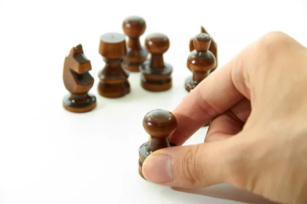 Piezas de ajedrez y mano derecha — Foto de Stock