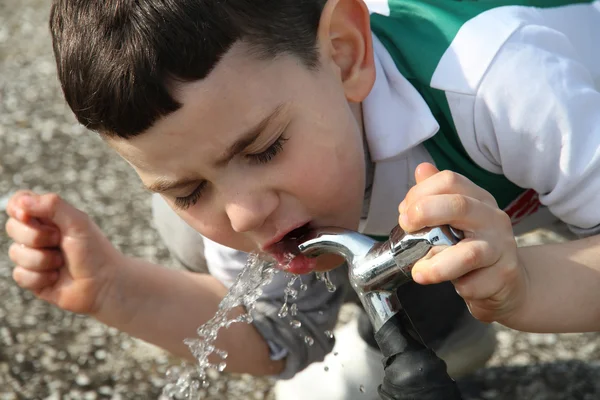 Boy Drinking Water From A Tap — Stock Photo, Image