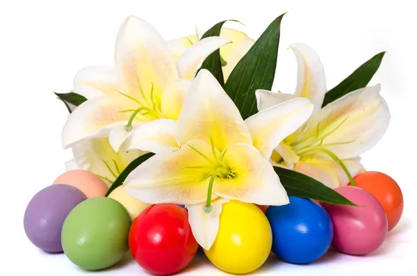 Easter eggs and lily — Stock Photo, Image
