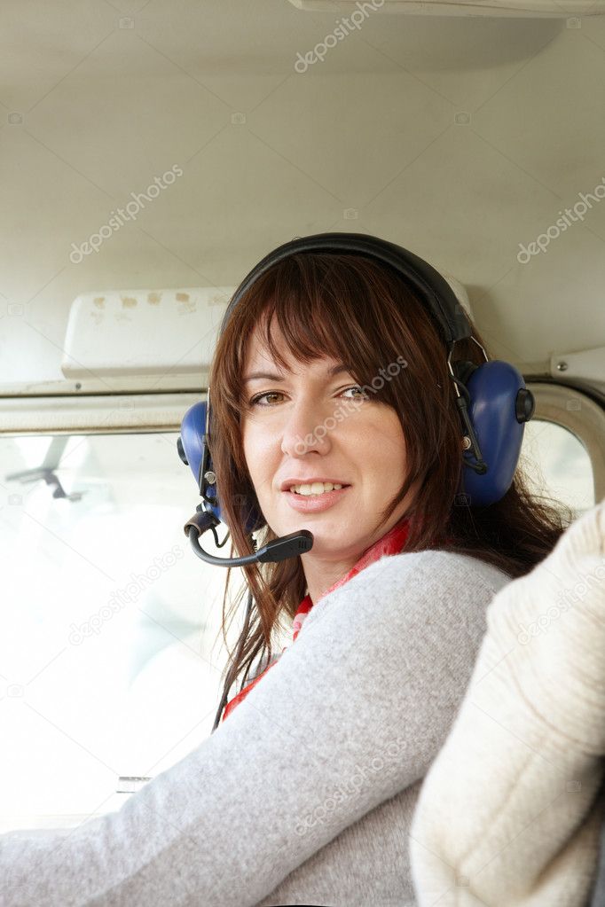 Woman pilot in plane