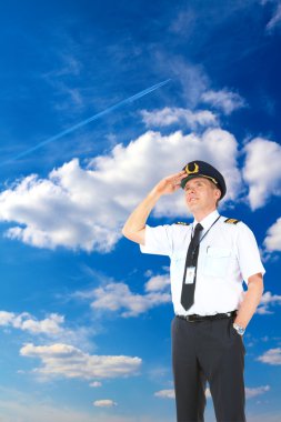 Airline pilot looking upwards clipart