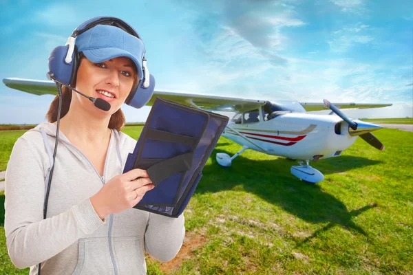 Pilot with headset and knee-pad — Stock Photo, Image