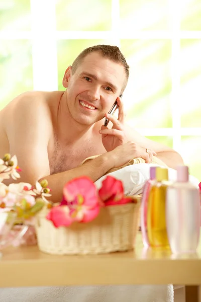 Busy business man in spa salon — Stock Photo, Image