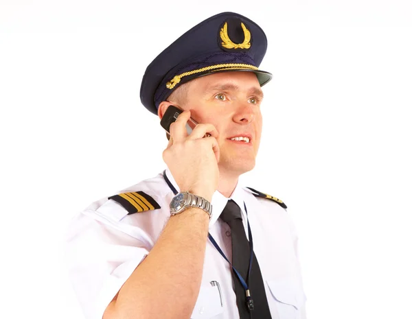 Airline pilot on the phone — Stock Photo, Image