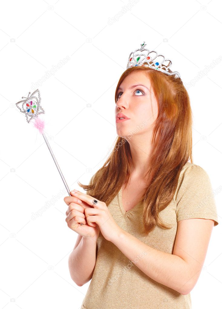 Attractive young woman holding a magic wand