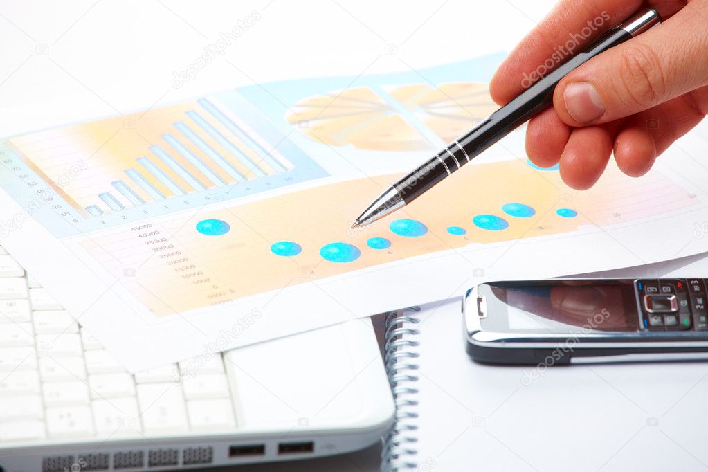 Business graphs and male hand