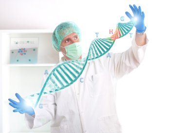 Researcher holding up a DNA strand in the laboratory clipart