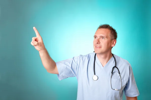 Médico de medicina apontando para algo com o dedo — Fotografia de Stock