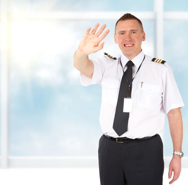 Piloto de linha aérea acenando — Fotografia de Stock