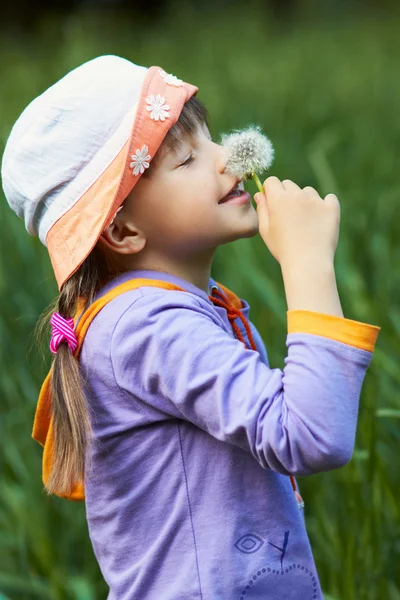 Cheerful girl with dandelion — Stock Photo, Image