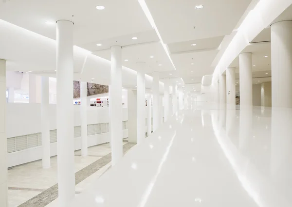 Inside a building with white columns