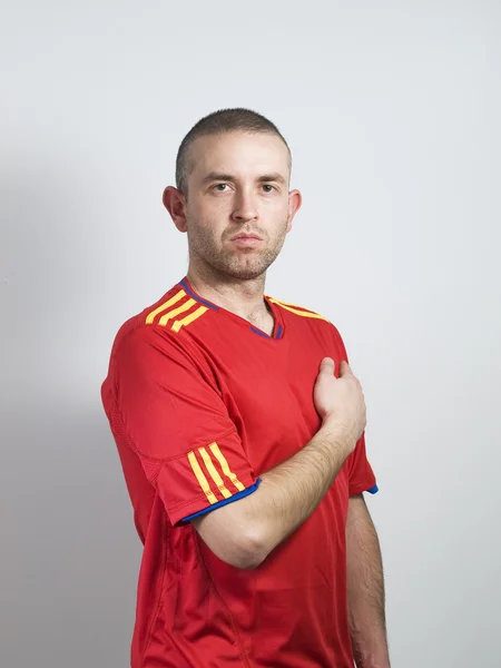 スペイン語ファンの彼の胸に手 — ストック写真