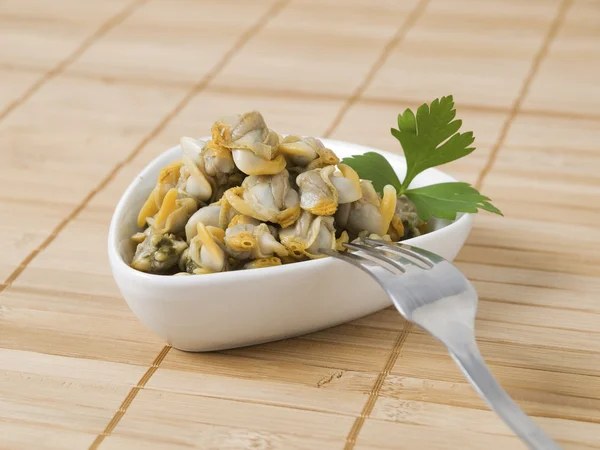 Bowl with cockles and fork — Stock Photo, Image