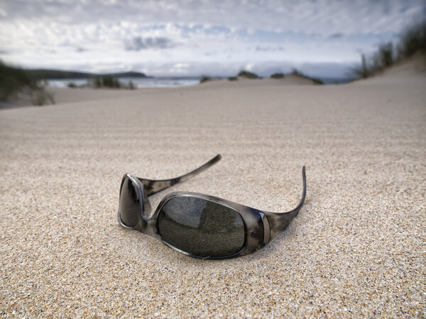 Sunglasses abandoned on the beach