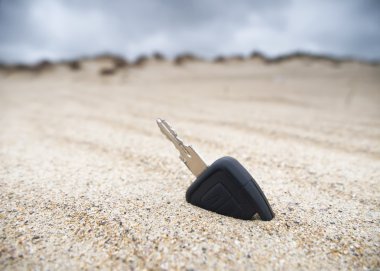 Car key in the sand clipart