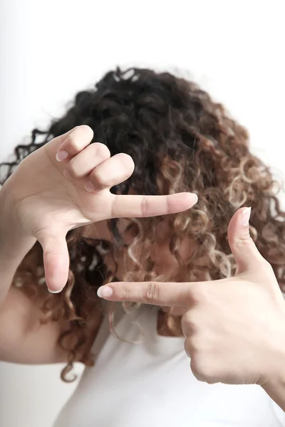 stock image Young woman making a rectangular frame with her both hands