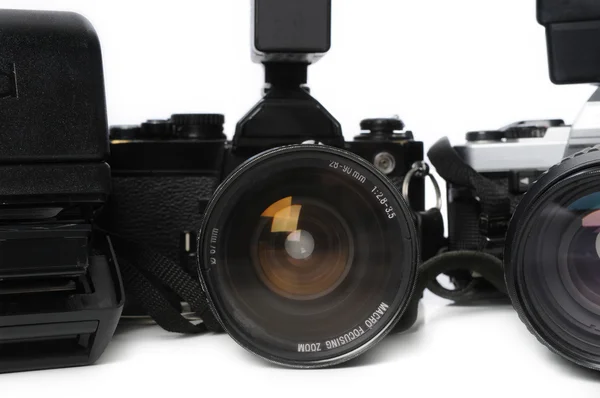 Close up of vintage instamatic and 35mm SLR cameras — Stock Photo, Image