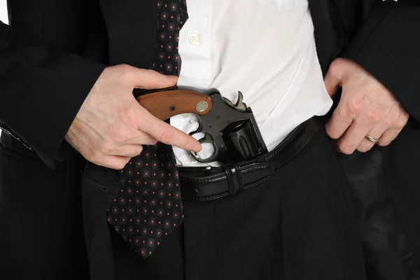 Пистолет в штанах — стоковое фото