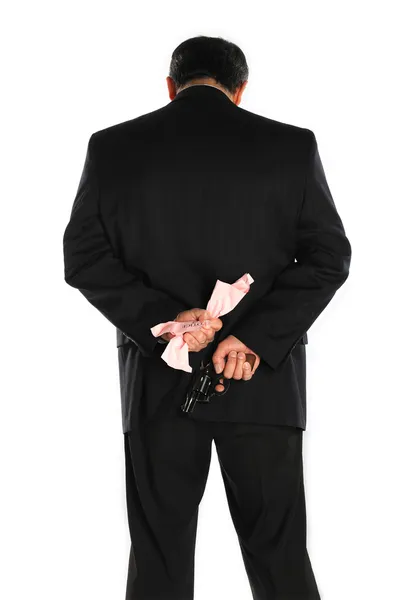 Pistol behind the suit — Stock Photo, Image