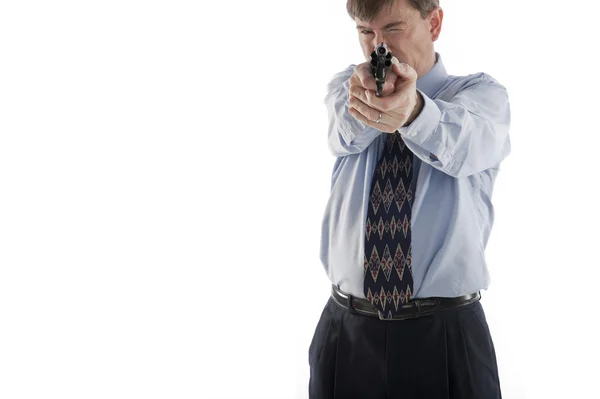 Businessman aiming pistol — Stock Photo, Image