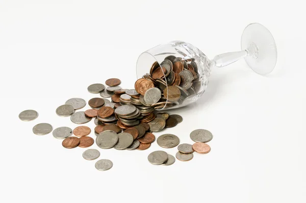 Spilled crystal goblet of coins — Stock Photo, Image