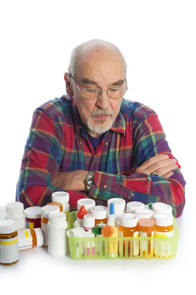 Starší muž a medicína láhve — Stock fotografie
