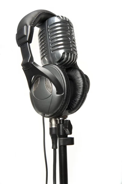 stock image Vintage Microphone with modern headphones