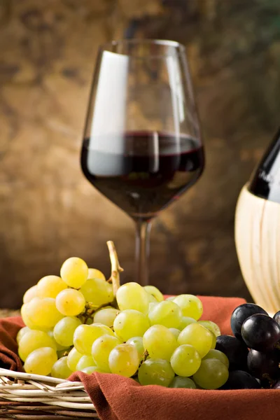 Grapes, bottle and a glass of wine — Stock Photo, Image