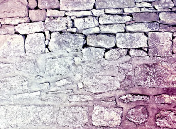 Grungy Tapete aus Steinmauer — Stockfoto