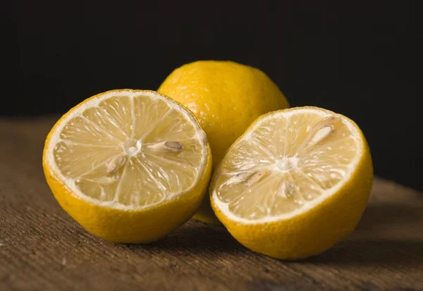 stock image Fresh lemons on the wooden table