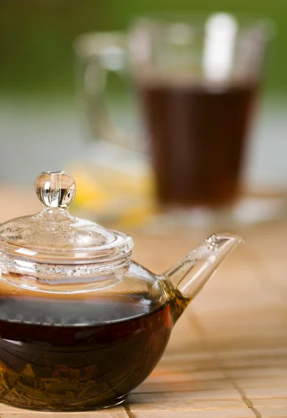 Teapot full of tea on the table — Stock Photo, Image