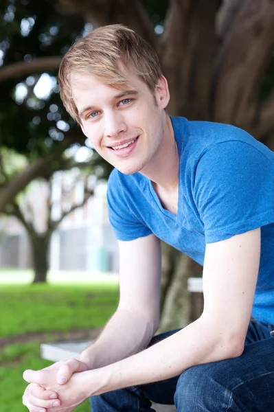 Portrait of a young male in a park — Stock Photo, Image