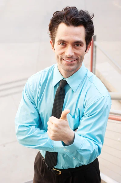 Male executive giving thumbs up — Stock Photo, Image