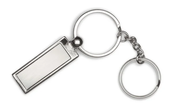 Silver keychain on white background — Stock Photo, Image
