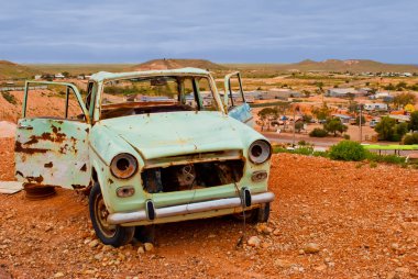 Abandoned rusty car in Coober Pedy, South Australia clipart