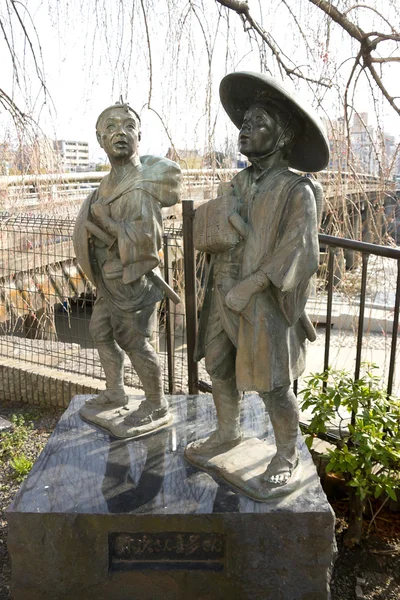 Staty av två bonde resenärer i kyoto, japan — Stockfoto