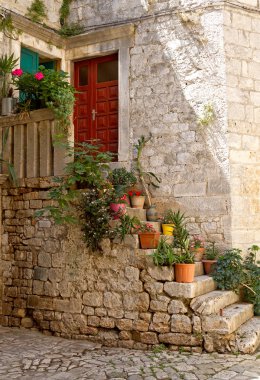 Ancient staircase with flowerpots. clipart