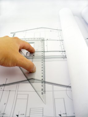 Measuring on blueprints clipart