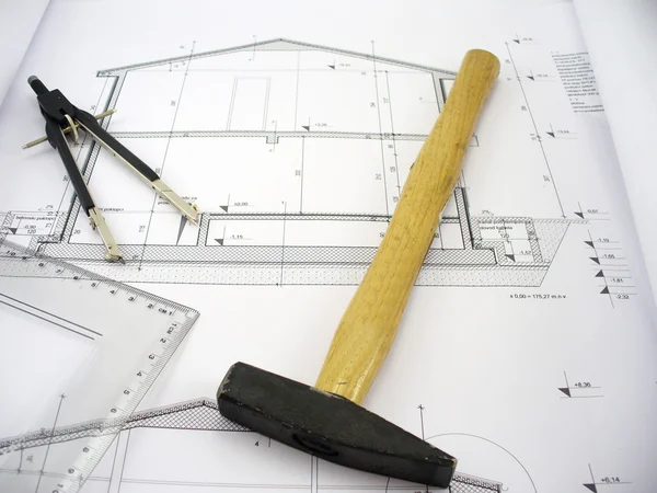 Hammer on house plans — Stock Photo, Image