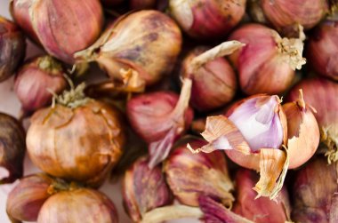 Pile of shallots isolated on white background clipart