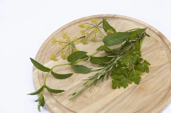 Herbs on a cutting board — Stock Photo, Image