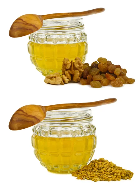 Honung med valnöt, russin och pollen Stockbild