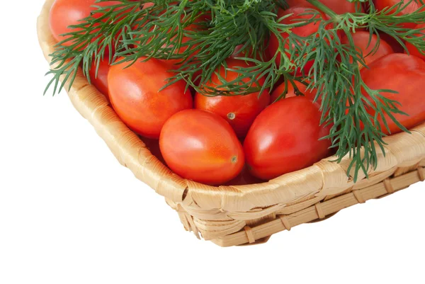 Rode tomaten in een mand — Stockfoto