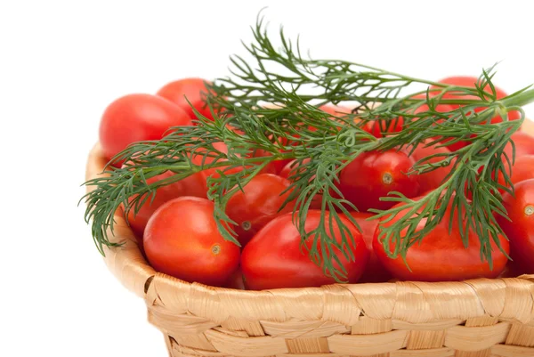 Rode tomaten in een mand — Stockfoto
