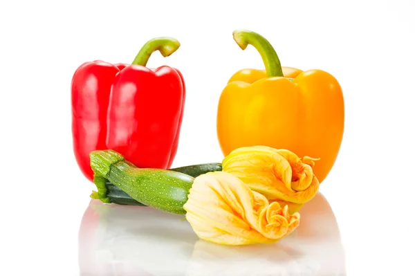 Squash blossoms and peppers — Stock Photo, Image