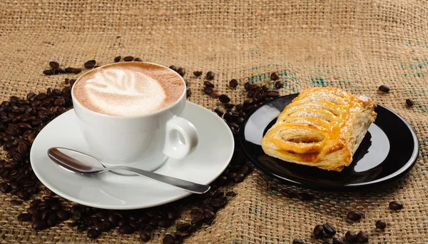 Cappuccino cup with croissant — Stock Photo, Image