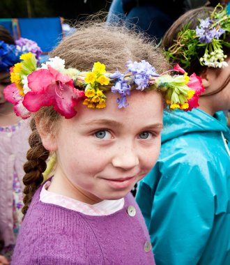 Young girl at May Day spring festival clipart